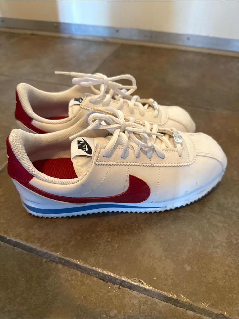 Nike Kids White Sneakers with Red Swoosh